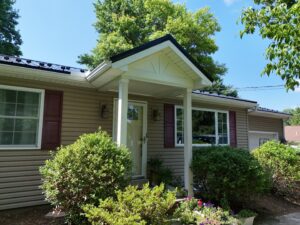 From Worn Asphalt Shingles to a Beautiful Black Metal Roof