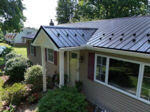 From Worn Asphalt Shingles to a Beautiful Black Metal Roof