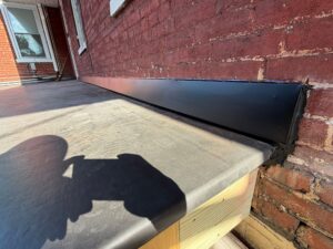 Solving Persistent Leaks with a New EPDM Porch Roof & Entry Door