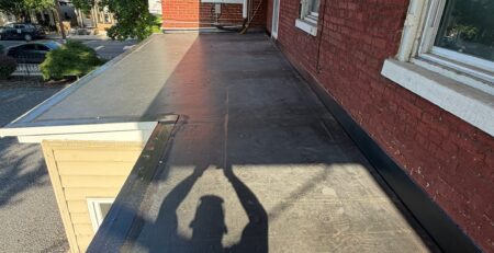 Solving Persistent Leaks with a New EPDM Porch Roof & Entry Door