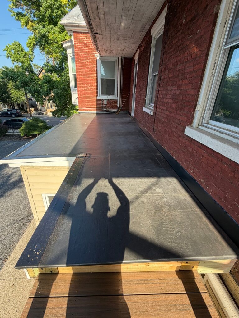 Solving Persistent Leaks with a New EPDM Porch Roof & Entry Door