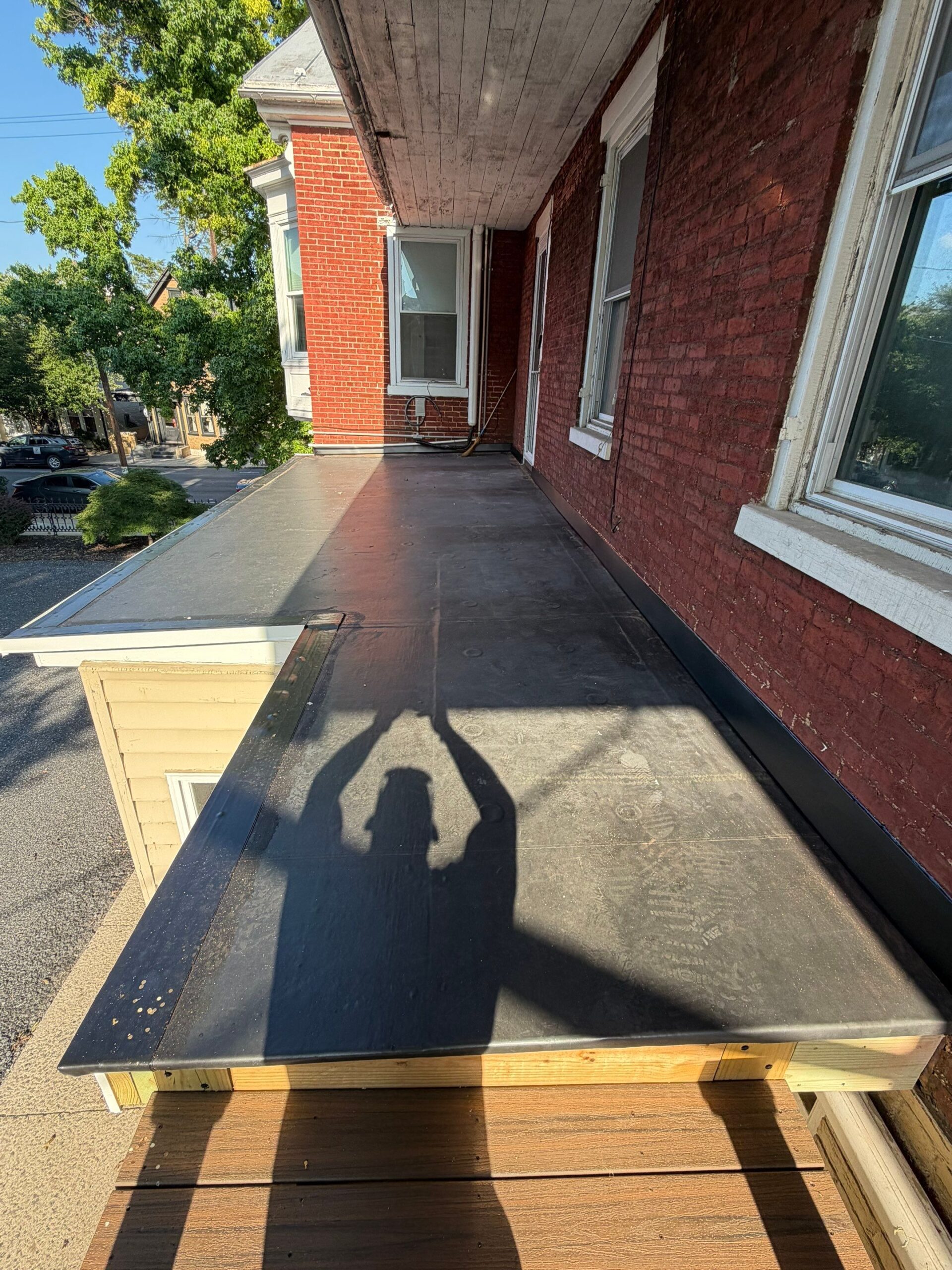 Solving Persistent Leaks with a New EPDM Porch Roof & Entry Door